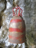 Bomb casing turned into Buddhist bell at Elephant Cave, Vang Vieng, Laos