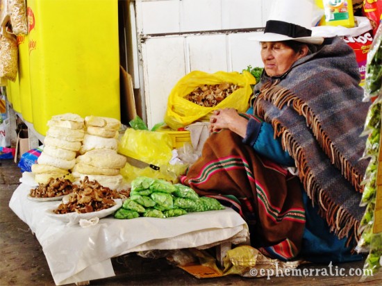 Mushroom seller naps in Cusco's Central Market, Peru photo