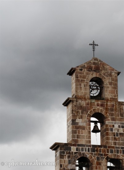 Simple bell tower of the San Blas Church, Cusco, Peru photo