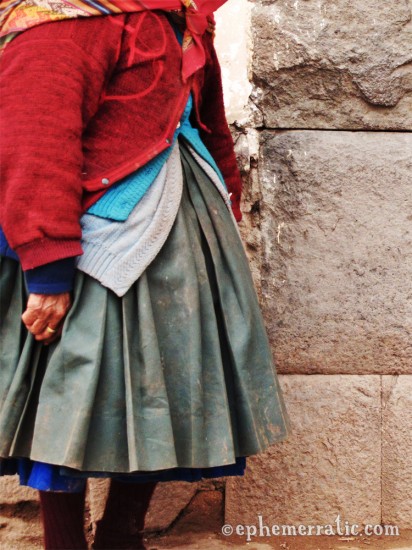 Peruvian woman wearing many sweaters, Cusco, Peru