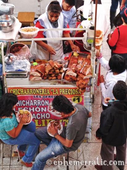 Eating chicharron, Mercado San Camilo, Arequipa, Peru photo