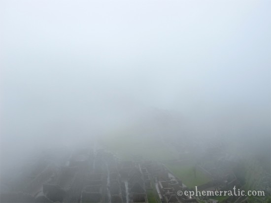 Thick fog hides Machu Picchu, Peru photo