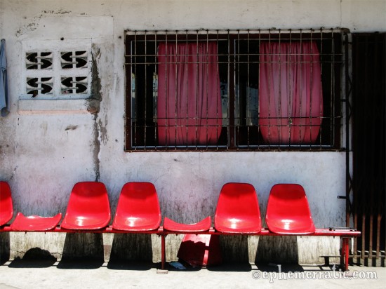 Red chairs at the docks, Manila, The Philippines photo