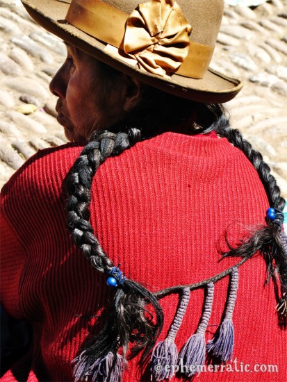 Quechua woman's traditional braids, Pisac, Peru