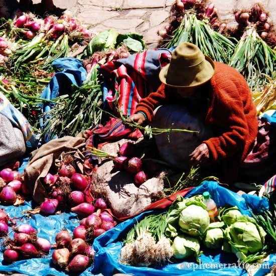 Onion seller at the Pisac Sunday Market, Peru photo