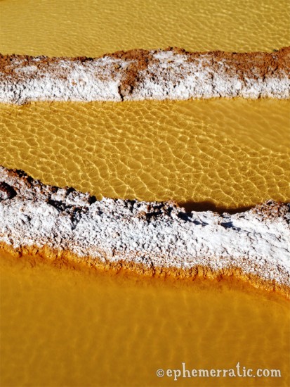 Rippled salt pond surface, Salineras, Peru photo