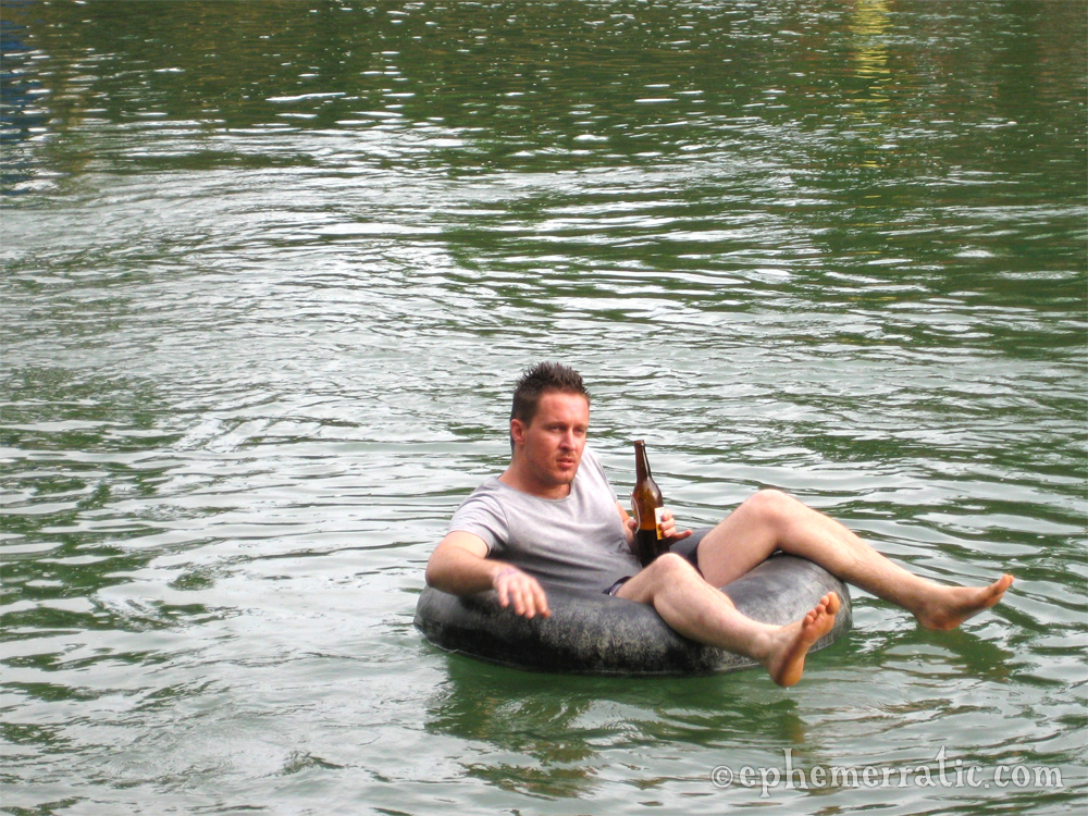 Tourist, Beer Lao, and a tube in Vang Vieng, Laos